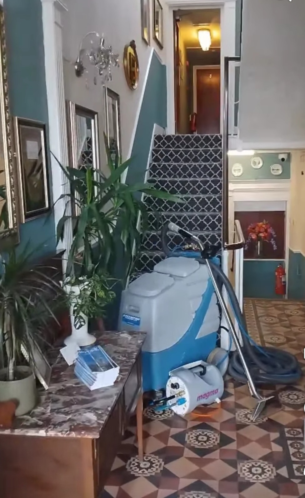 Hot water extraction carpet cleaning machine at work in a Weymouth guest house