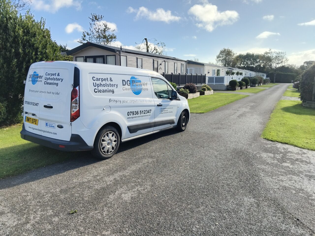 Carpet cleaners’ van parked among static caravans at West Hayes Caravan Park, Rousdon